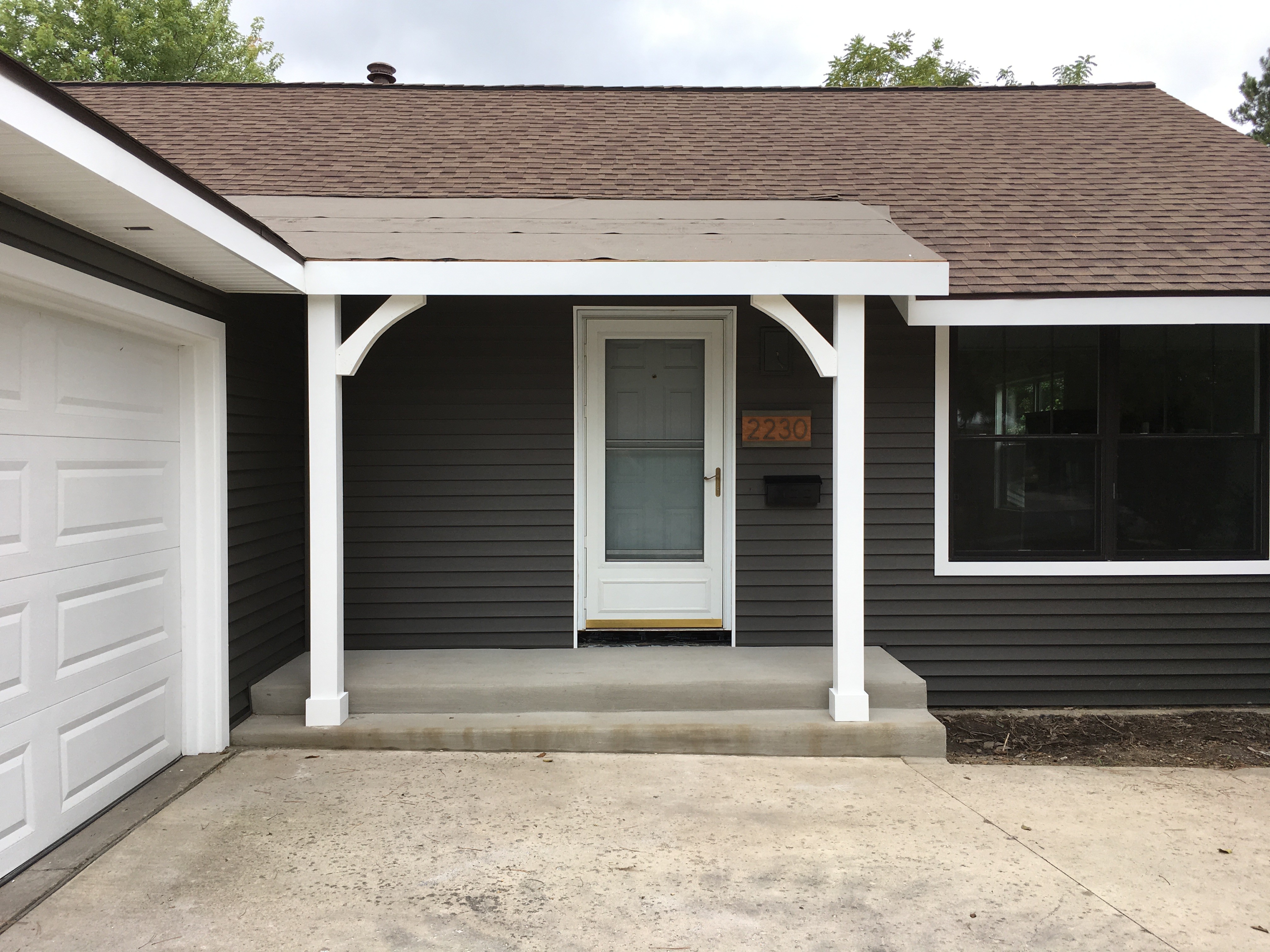 porch posts, house number, and mailbox